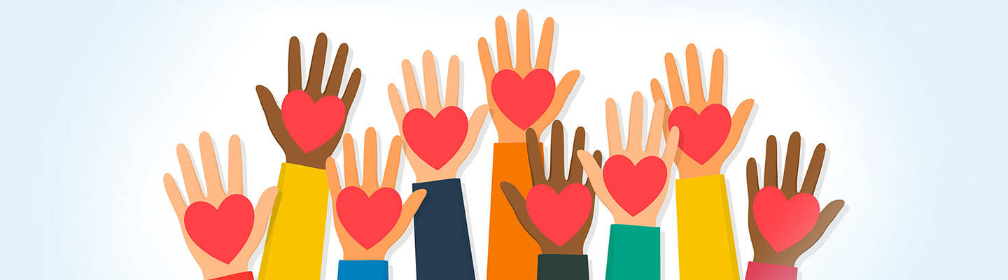 raised hands holding hearts