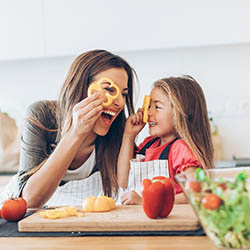 mother and daughter cooking healthy meal